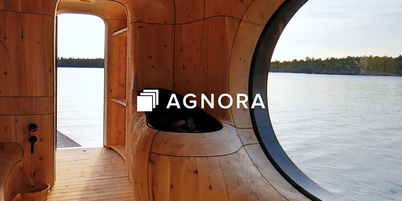 Pine sauna with beautiful glass inserts with Agnora Logo overlayed on top of it
