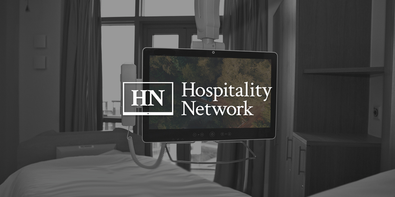 Hopsital bed with televison infront of viewer with Hopspitality Netowkr Logo overlayed on top of it